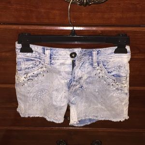 Light wash rhinestone denim shorts.